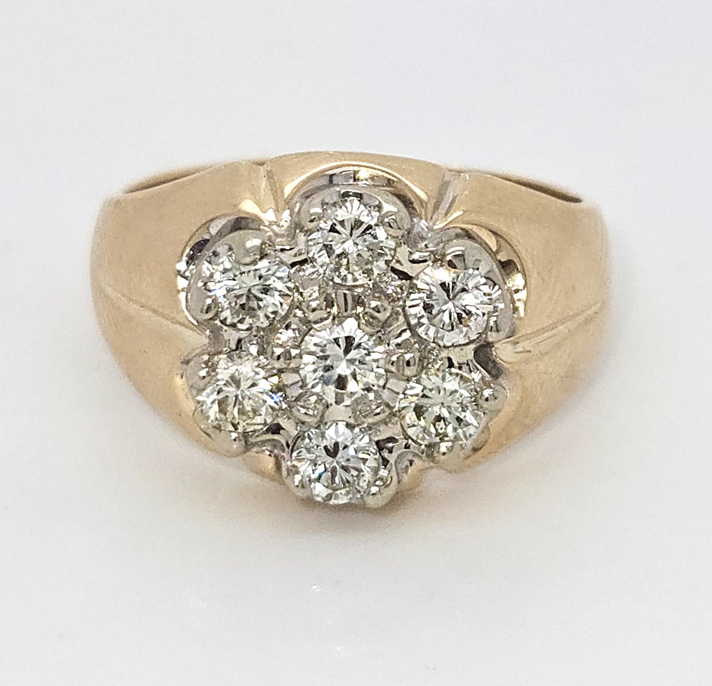 Elegance in Bloom: 14K Yellow Gold Ring with Flower-Shaped Diamond Pattern