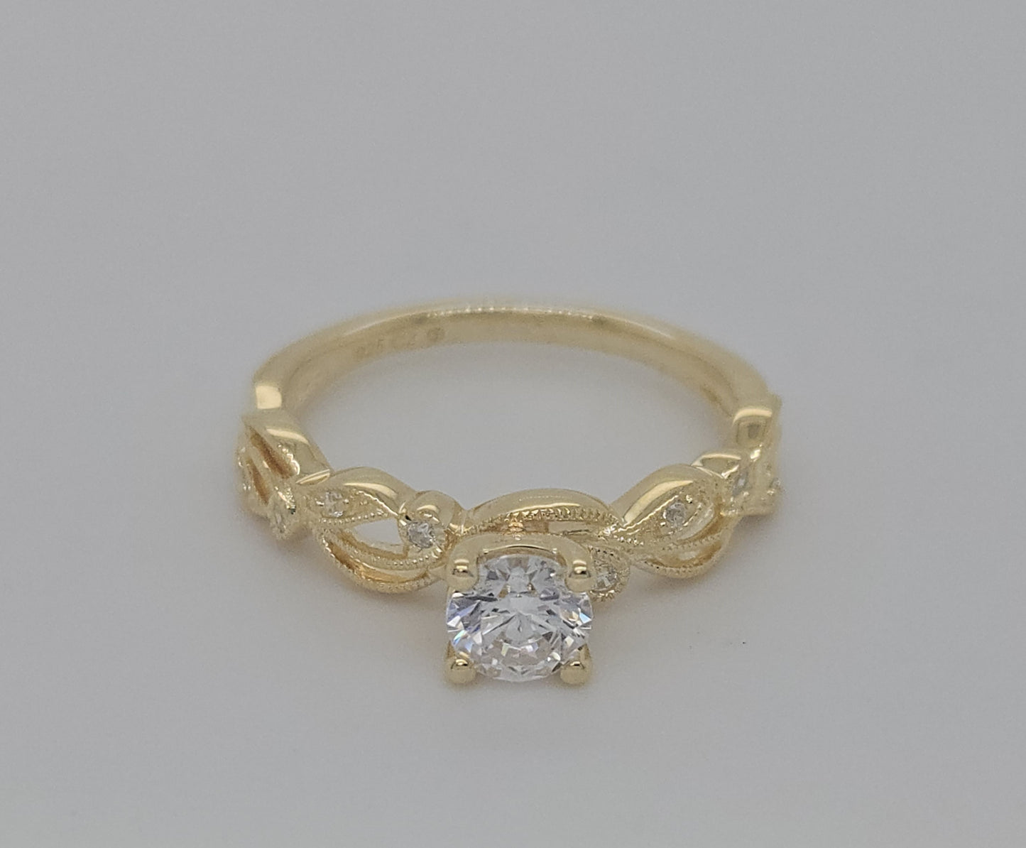 Vintage Bridal: .06 Ctw. Diamond Semi Mount with Millgrain Detail and 1/2 Ctw. Round Center Diamond in 14K Gold