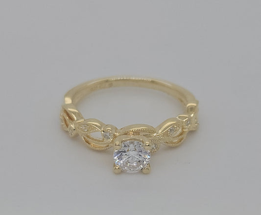 Vintage Bridal: .06 Ctw. Diamond Semi Mount with Millgrain Detail and 1/2 Ctw. Round Center Diamond in 14K Gold