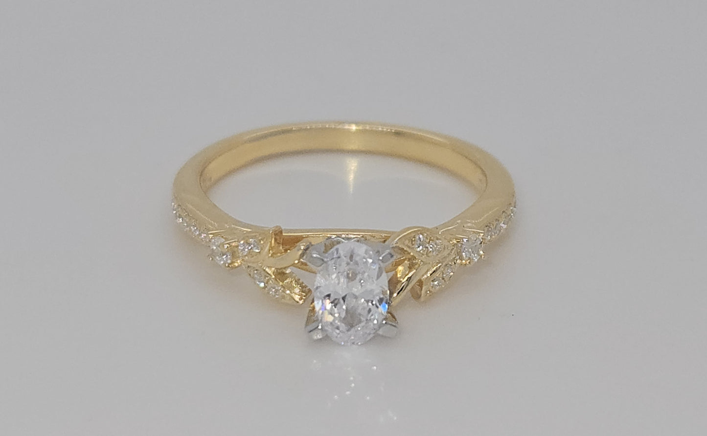 Forever Elegant® 1/8 Ctw. Diamond Semi Mount with 1/2 Ct. Oval Center Diamond in 14K Gold